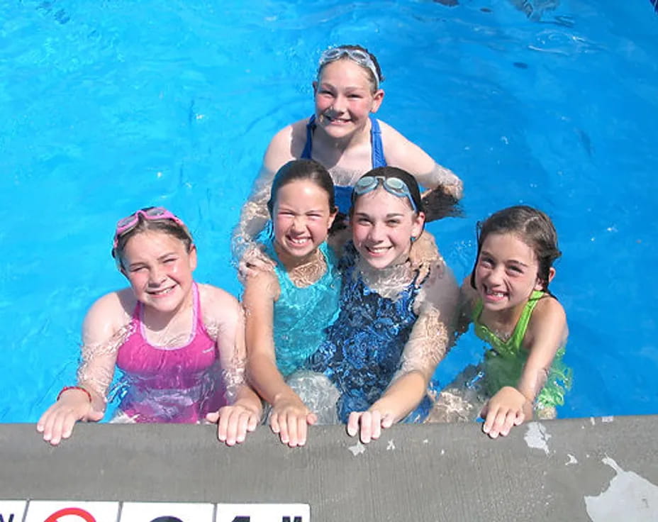 a group of people in a pool