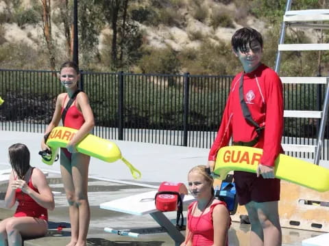 a group of people playing with frisbees