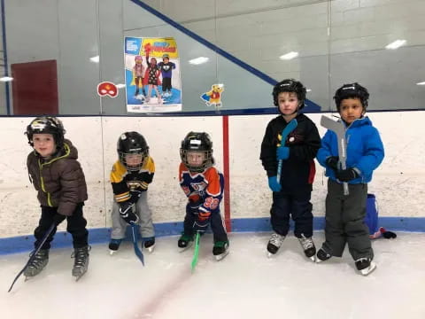 a group of kids wearing hockey gear