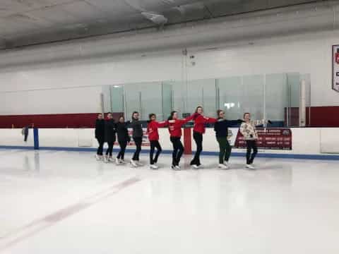 a group of people on an ice rink
