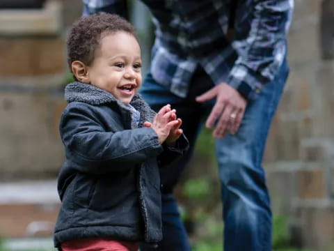 a child running away from a person