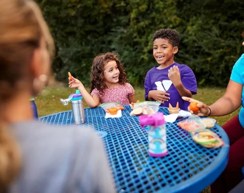 a group of people eating at a table