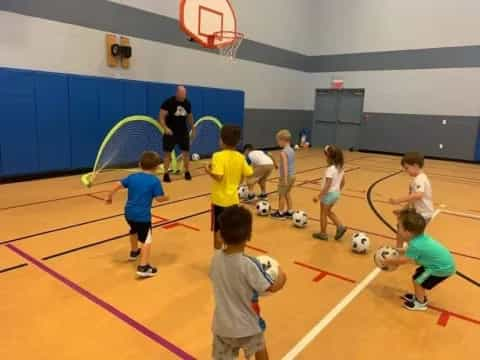 kids playing with football balls