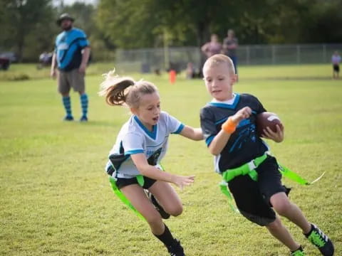 a group of kids playing rugby