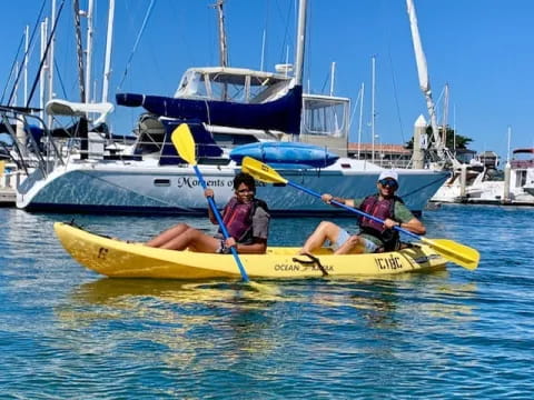 a couple of people in a canoe