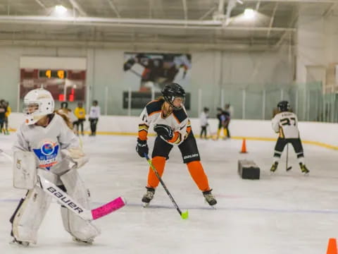 a group of people playing hockey