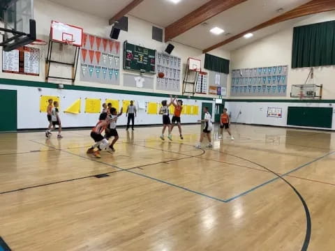 a group of people playing volleyball