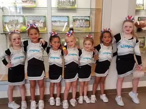 a group of girls in matching uniforms