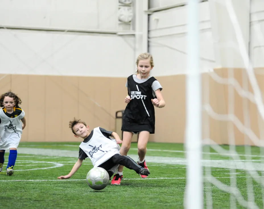 a group of girls playing football