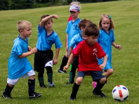 kids playing football on a field