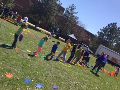 a group of people playing with kites