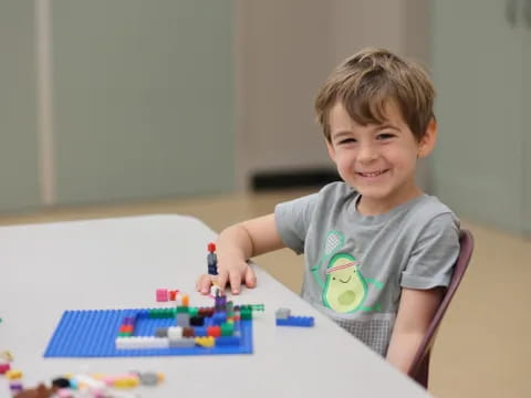 a boy playing with toys