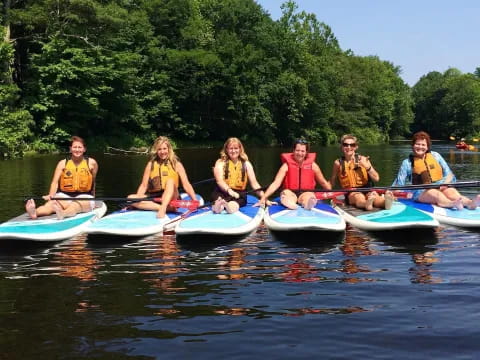 a group of people in kayaks