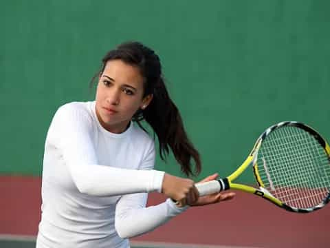 a woman playing tennis