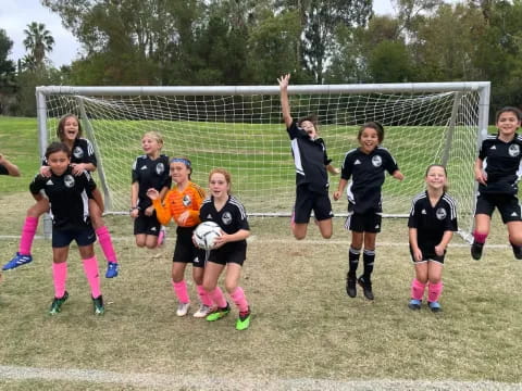 a group of girls playing football