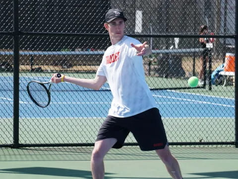 a man playing tennis