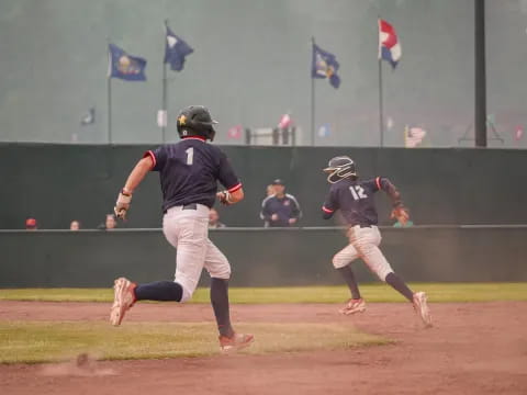 a baseball player running to home plate