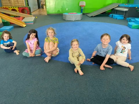 a group of children sitting on the floor