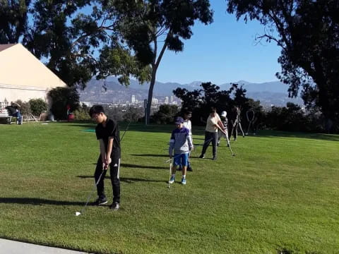 a group of people playing in a park