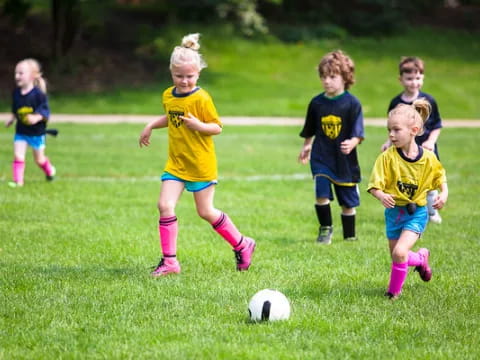 a group of kids playing football