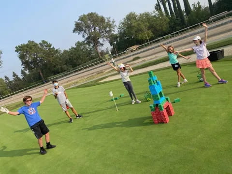 a group of people playing frisbee