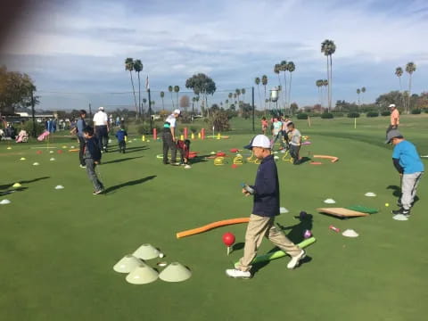 a group of people playing golf