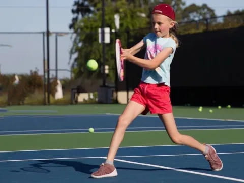 a girl playing tennis