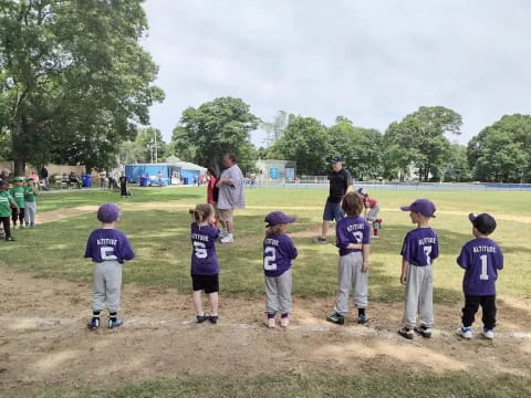 a group of kids in a field