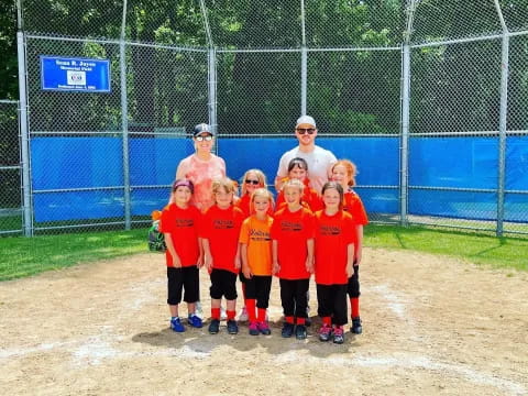 a group of kids in red uniforms