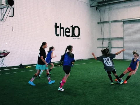 a group of girls playing football