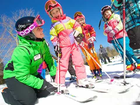 a group of skiers pose for a photo