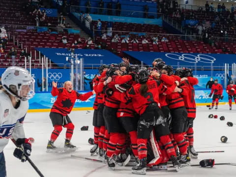 a group of hockey players celebrating