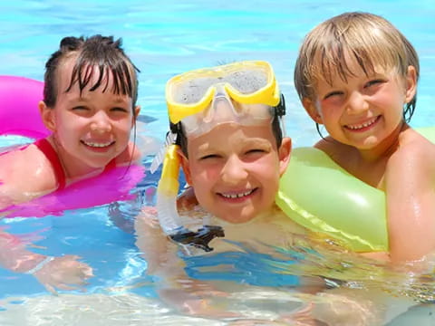 a group of kids in a pool