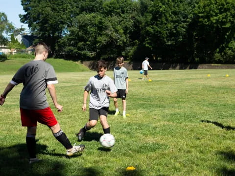 a group of kids playing football