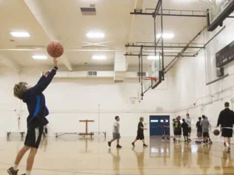 a person shooting a basketball