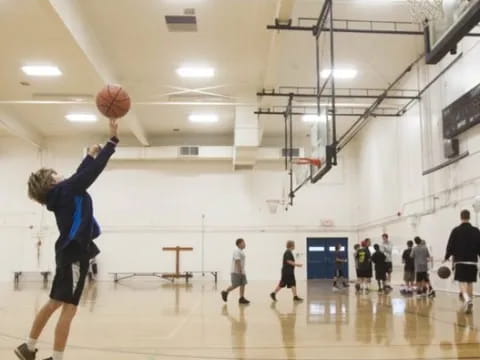 a person shooting a basketball