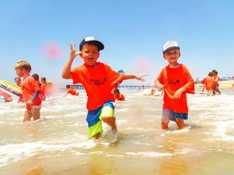 a group of kids playing in the water