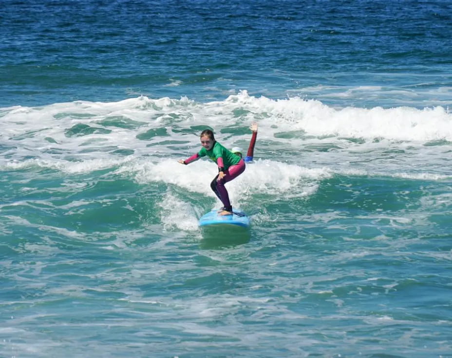 a person surfing on the waves