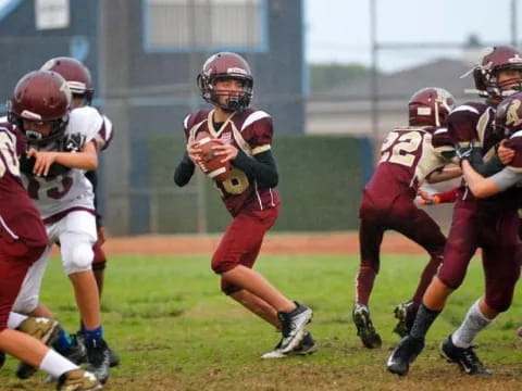 a group of people playing football