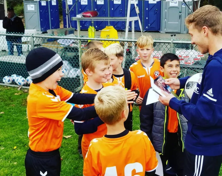 a group of boys in sports uniforms