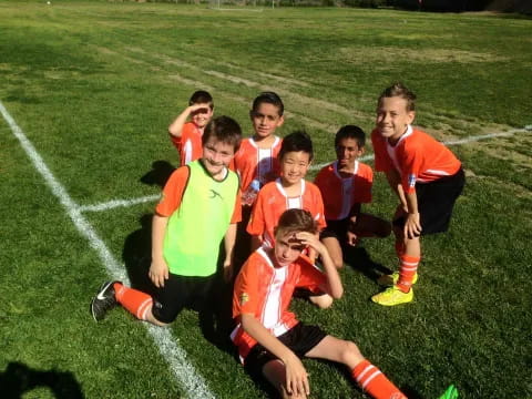 a group of boys in football uniforms