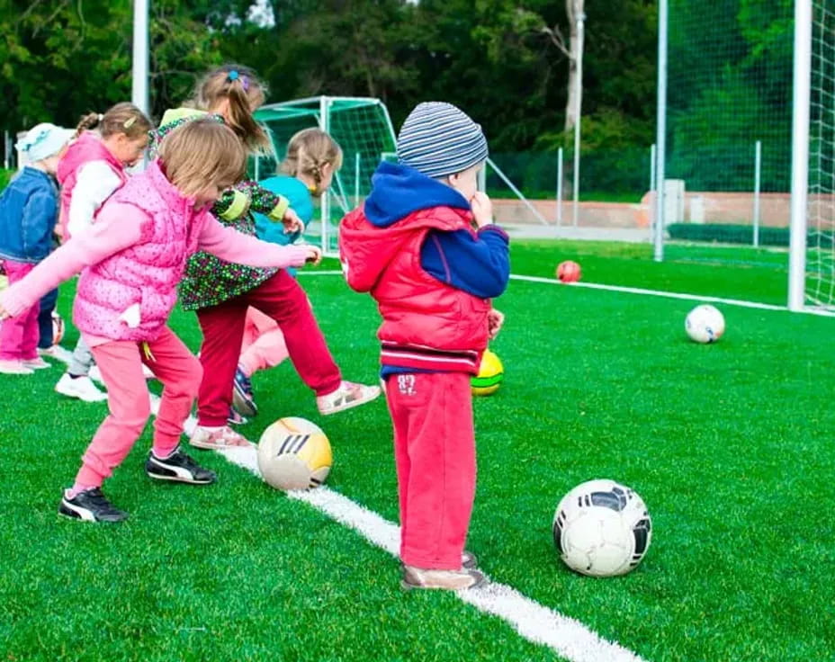 kids playing with football balls