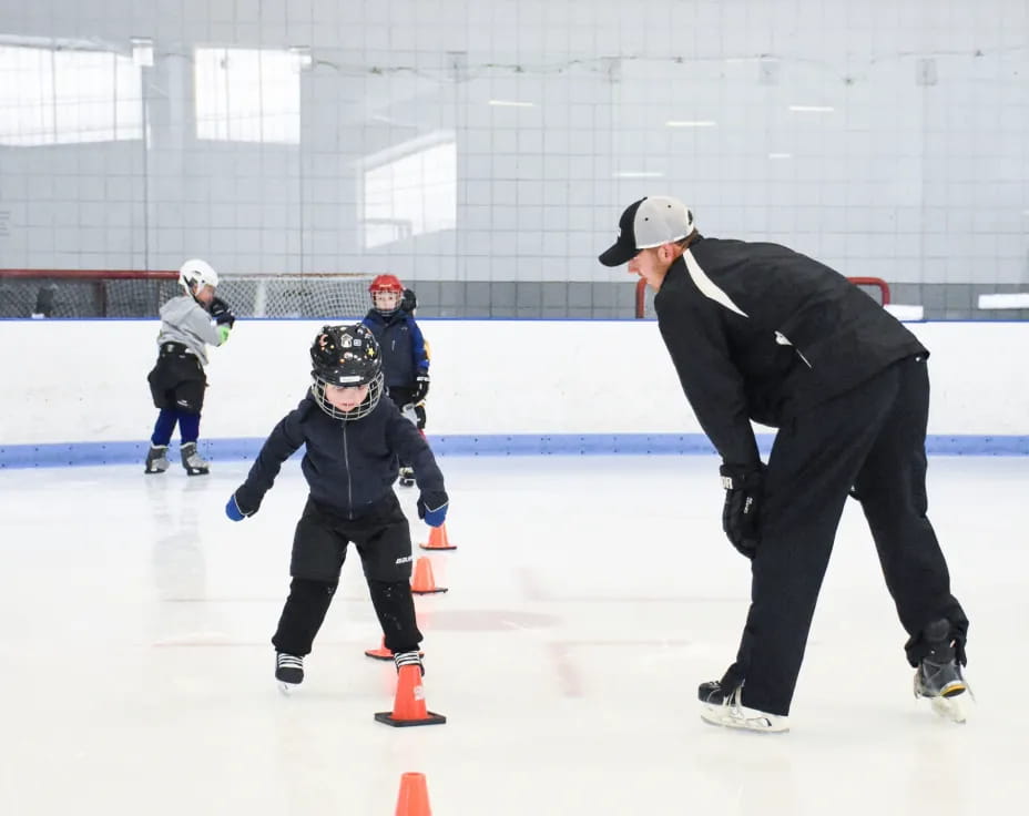 a person and a boy ice skating