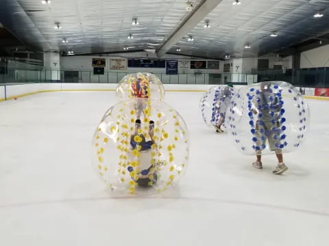 an ice rink with a large globe