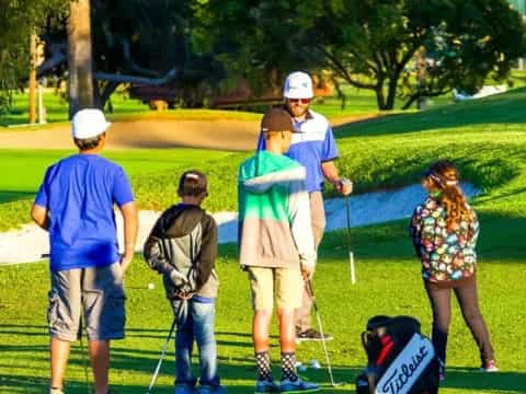 a group of people playing golf