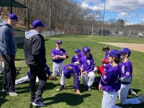 a group of people in purple uniforms