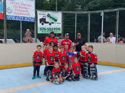 a group of people in sports uniforms posing for a photo