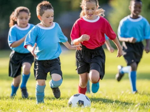 kids playing football on a field