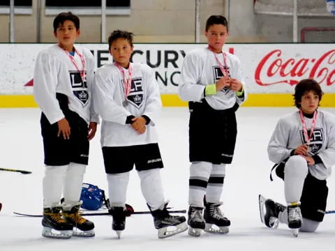 a group of boys wearing hockey uniforms