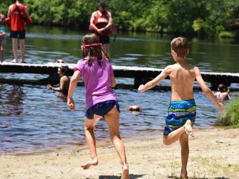 a couple of children playing in the water